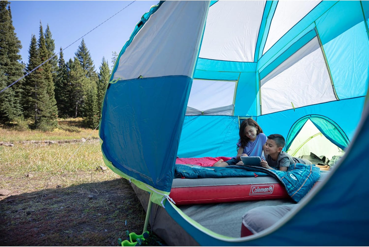 Coleman 50°F Sleeping Bag, Comfortable Youth Sleeping Bag for Sleepovers & Camping, Fits Children up to 5ft Tall, Glow in The Dark Design, Stuff Sack Included, Machine Washable